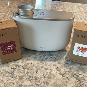 Area home diffuser with two frangrance capsules